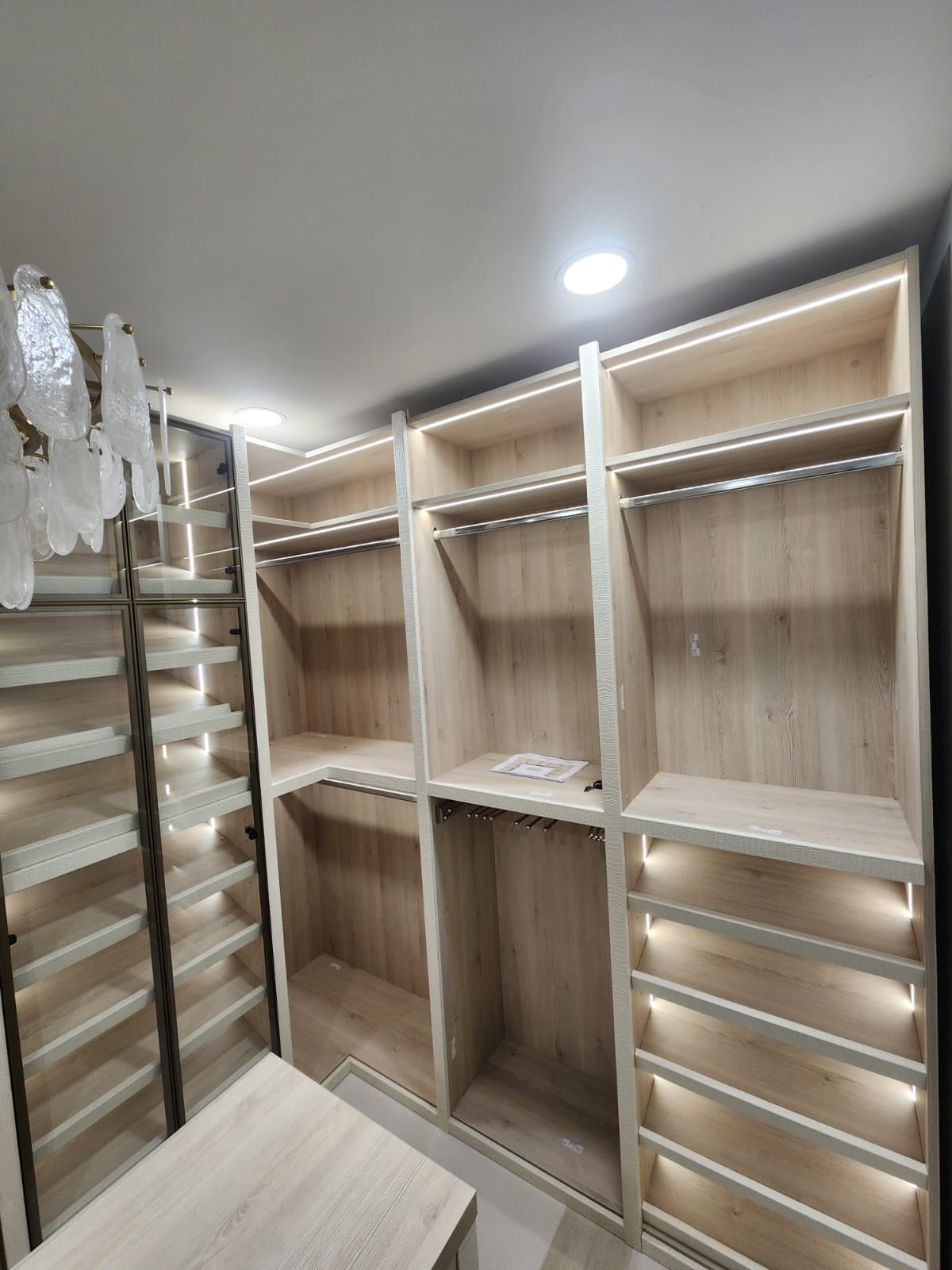 Custom closets Palm Beach County β walk-in closet with glass-front tower cabinets